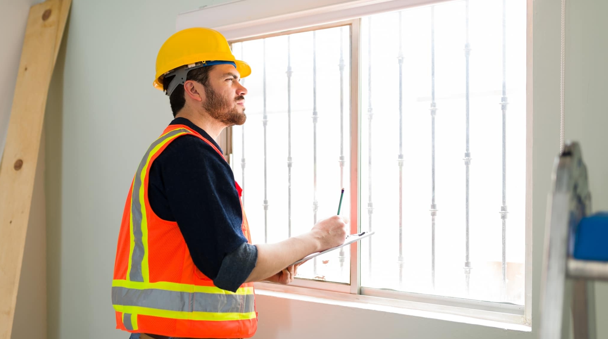 Professional contractor looking at the construction details